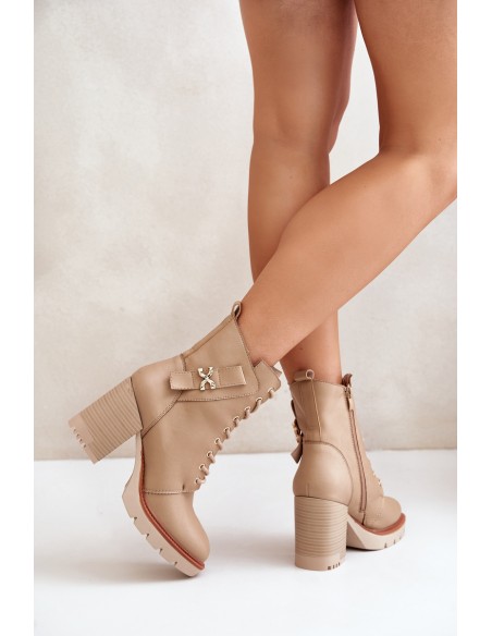 Insulated ankle boots on a heel with a golden detail beige Ivarisse