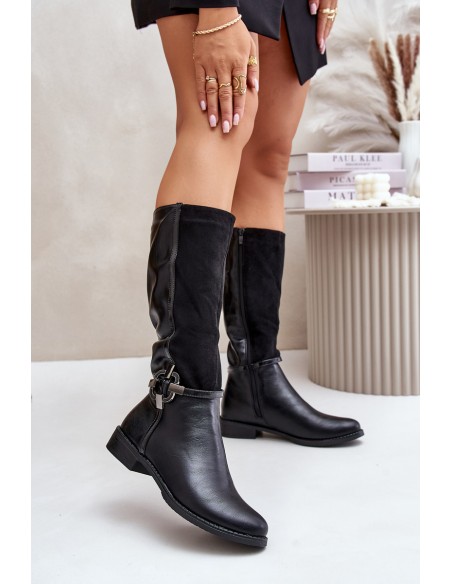 Insulated boots on a flat heel with a decorative buckle black Leatharia