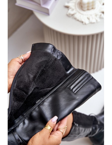 Insulated boots on a flat heel with a decorative buckle black Leatharia